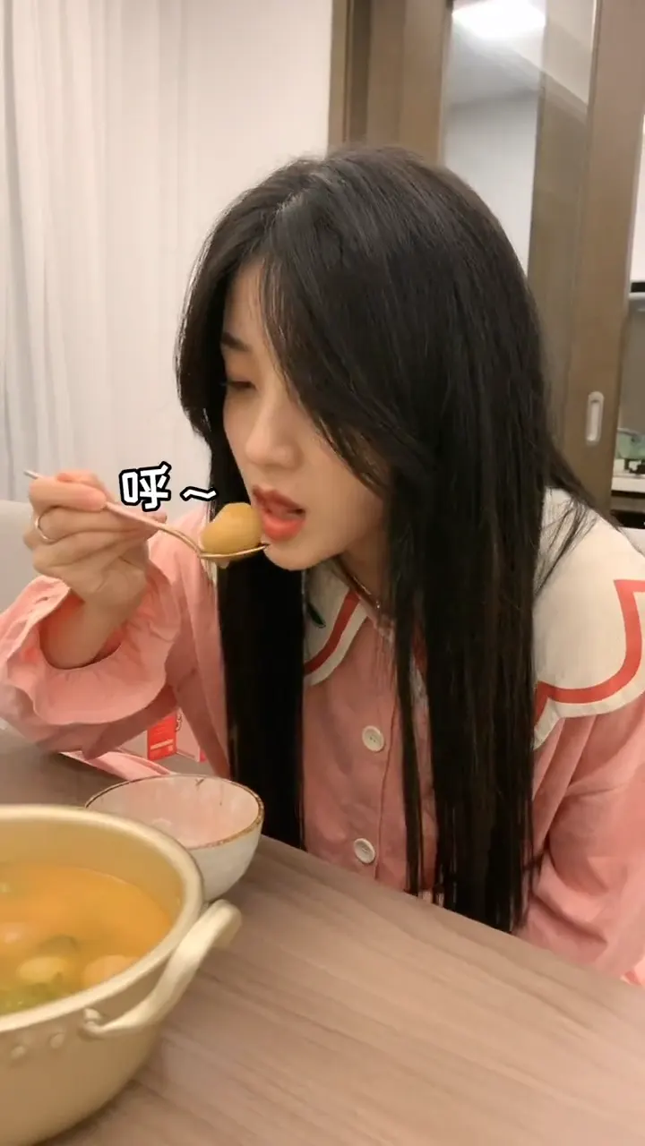 Girlfriend repeatedly trying to eat a scorching hot meatball and failing each time