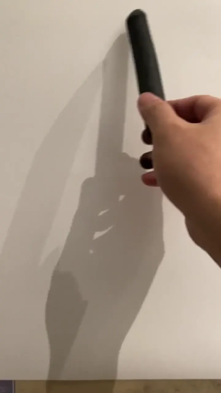 Artist using unconventional tools to create a stunning painting