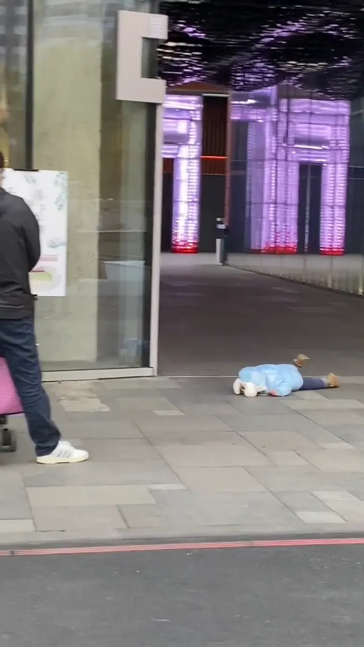 Clever baby finding a way to escape while parents look confused